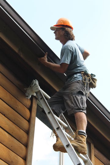 Gutter Installation Technician on Ladder